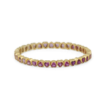 A yellow gold eternity bracelet featuring small heart-shaped purple gemstones set in a row, photographed on a clean white background.