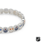 Silver-tone NHL charm bracelet with blue team logo beads, crystal accents, and a round clasp