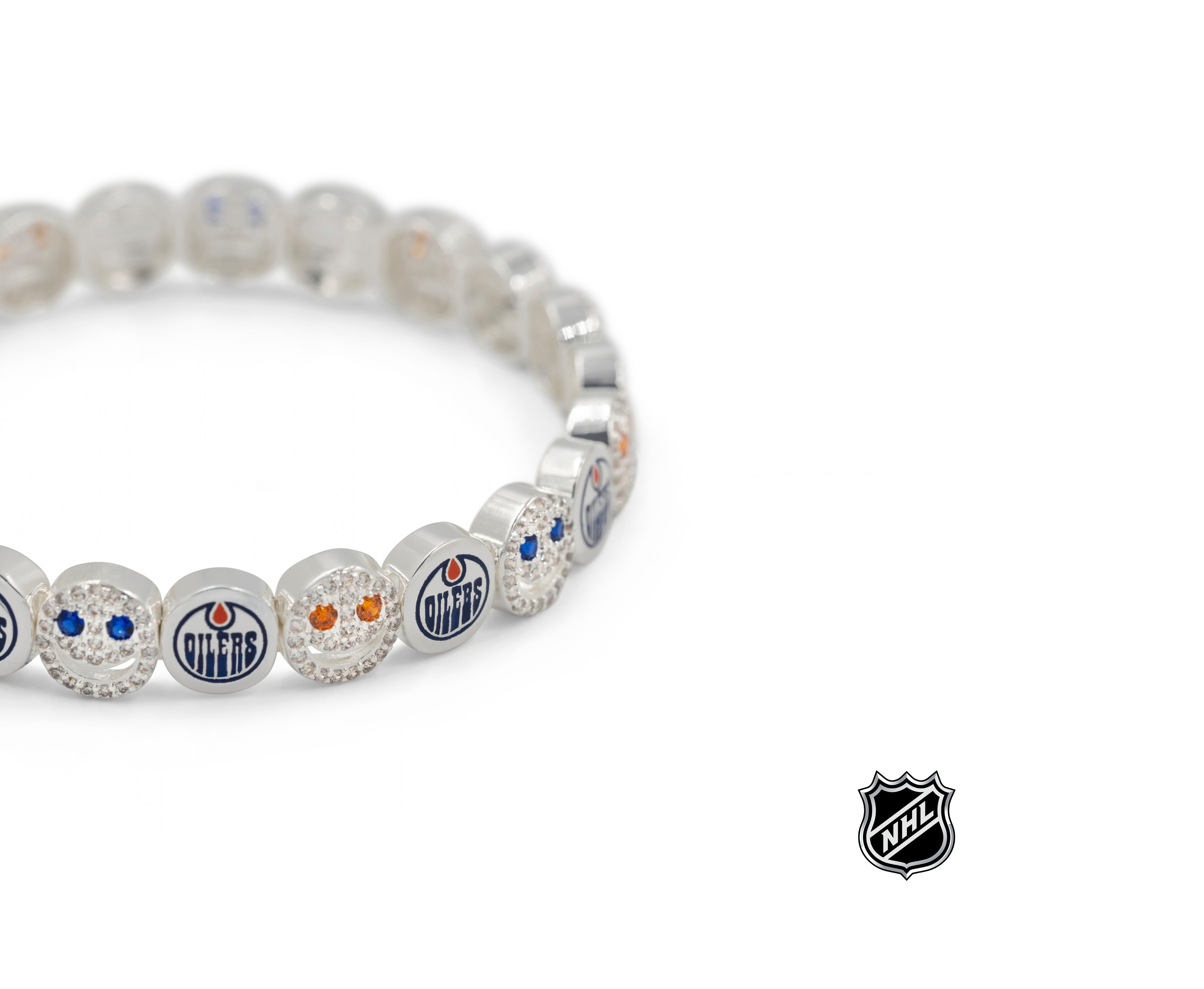 Silver-tone NHL charm bracelet with blue team logo beads, crystal accents, and a round clasp