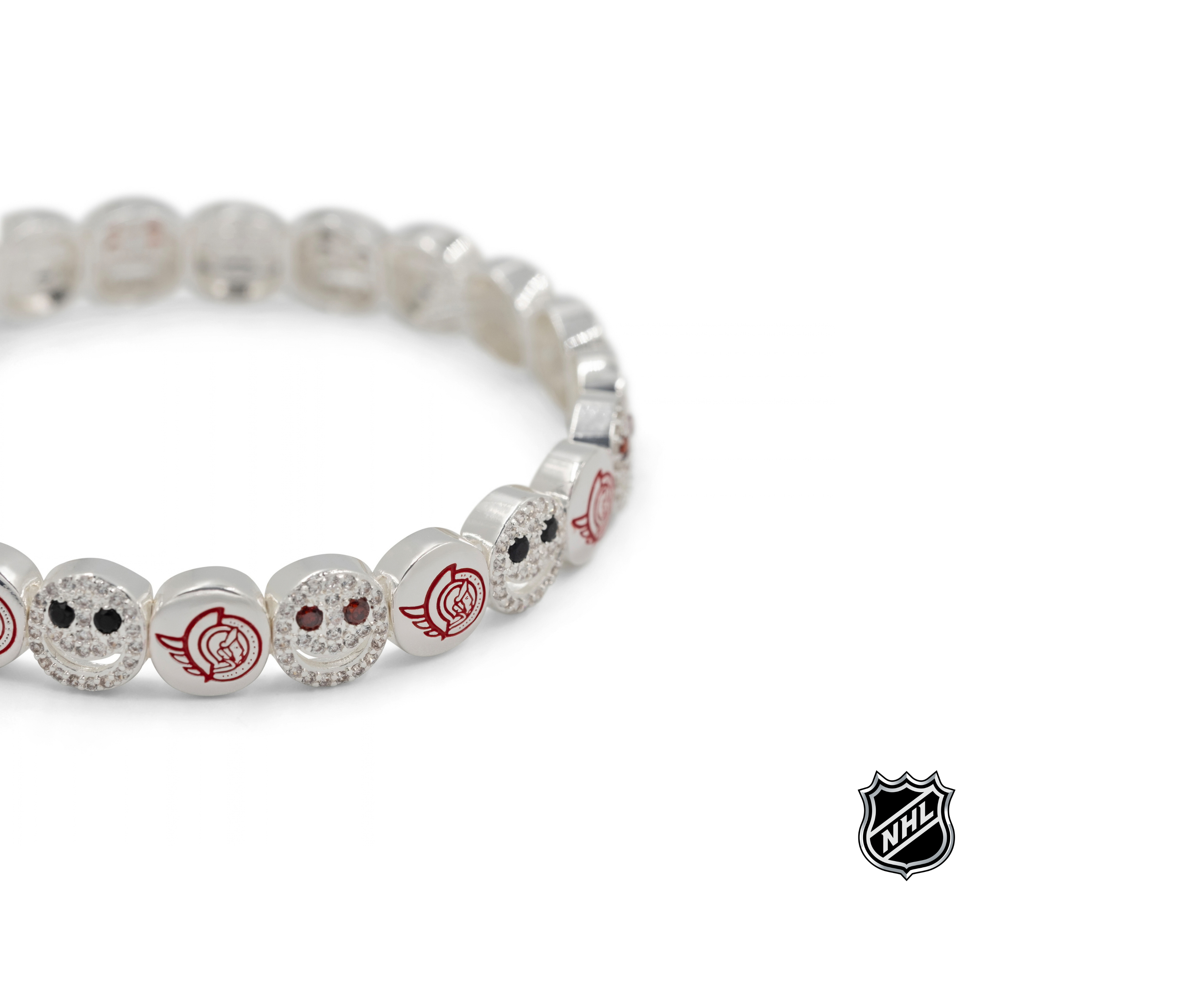 Silver-tone NHL charm bracelet with round glitter beads and colorful team logo accents