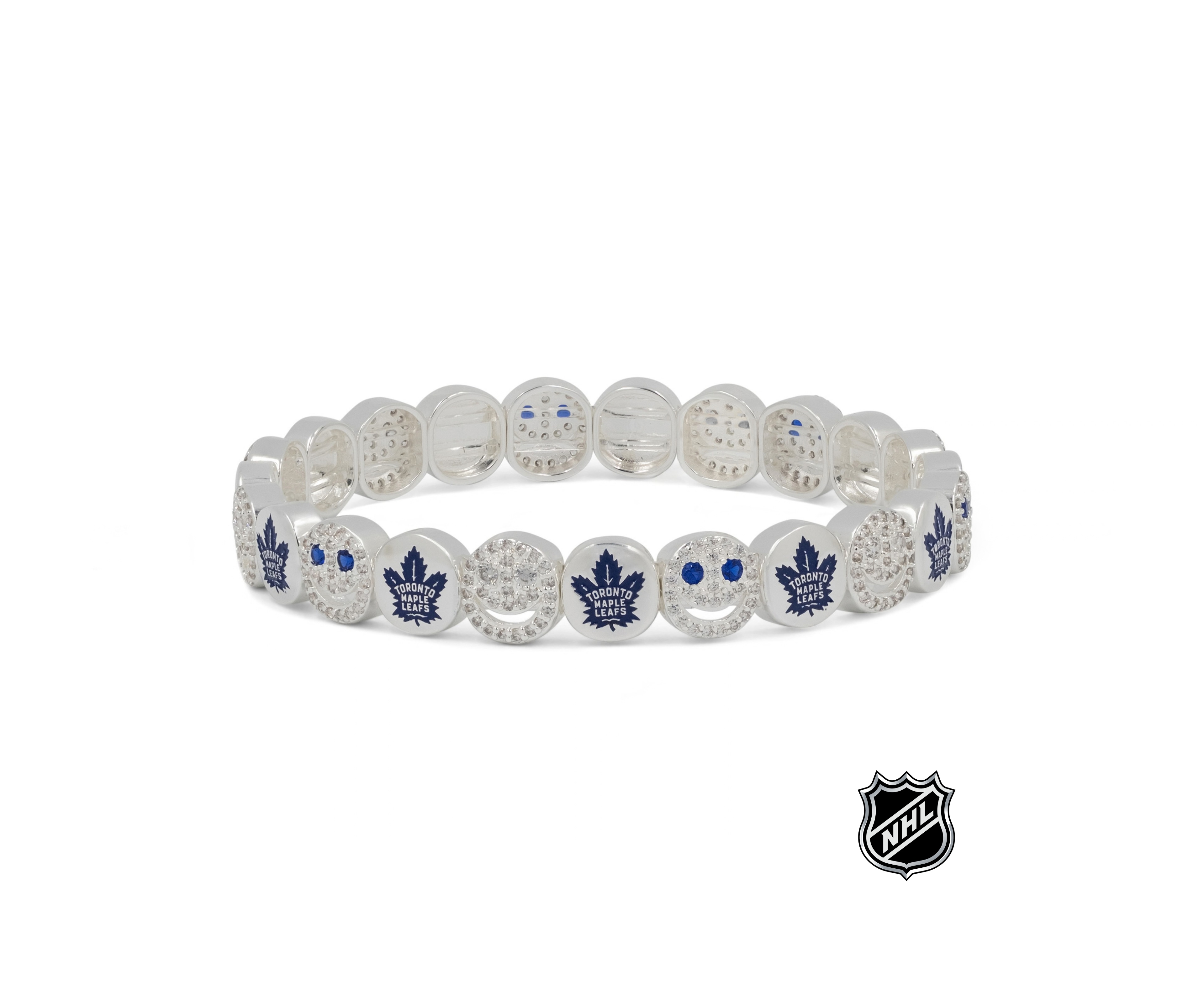 White beaded stretch bracelet with blue maple leaf emblems and crystal-like detail.