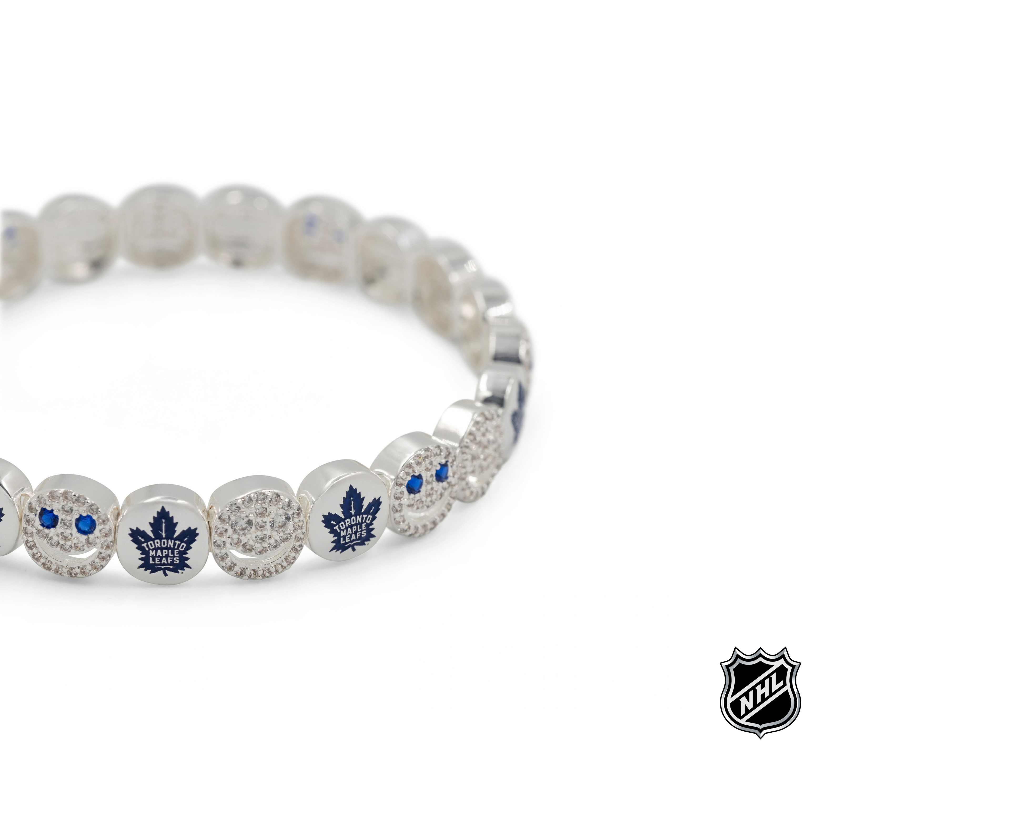 Silver-tone NHL charm bracelet with a blue maple leaf charm and sparkling round beads
