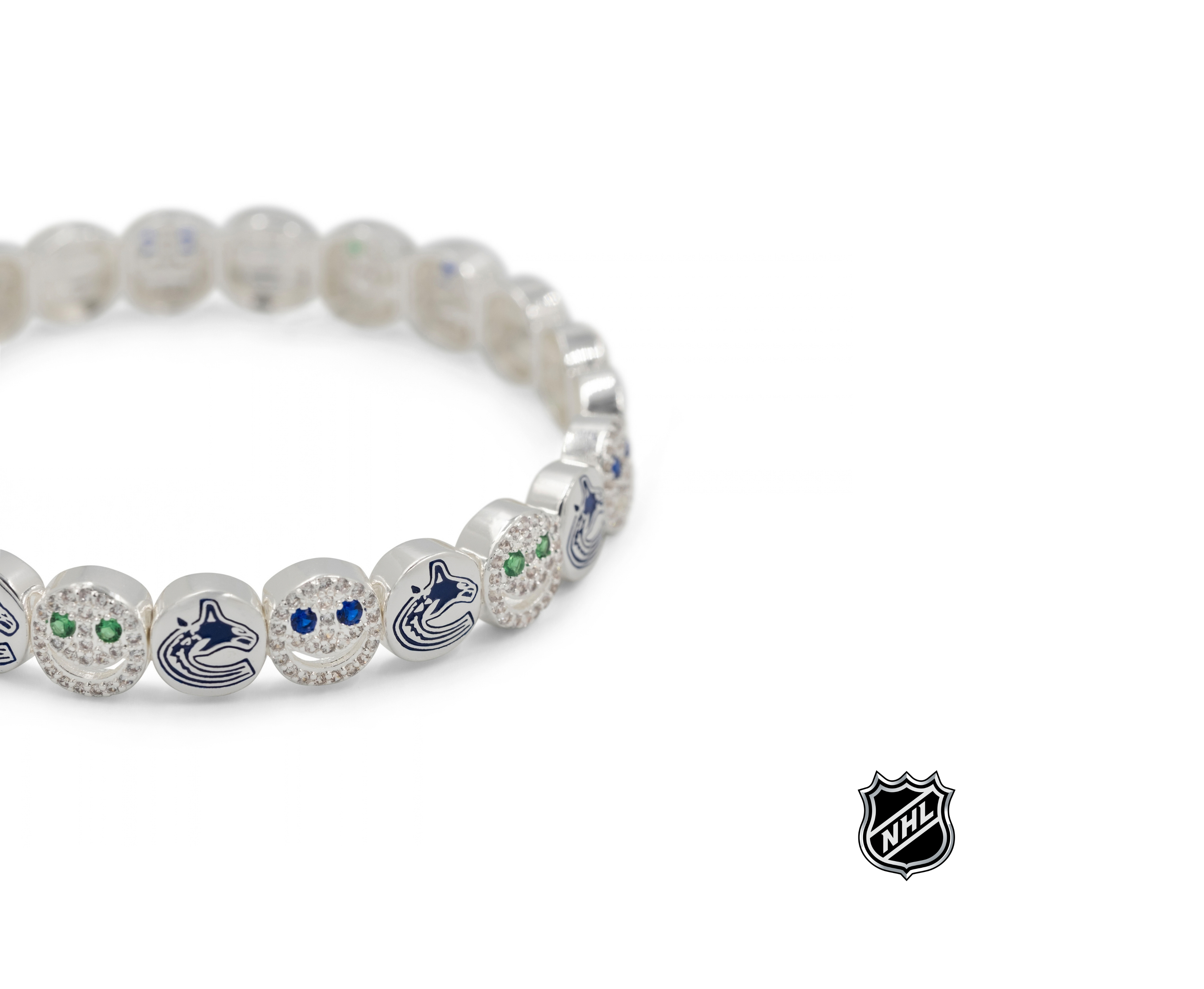 Silver-tone NHL charm bracelet with blue logo charms, crystal beads, and a round clasp