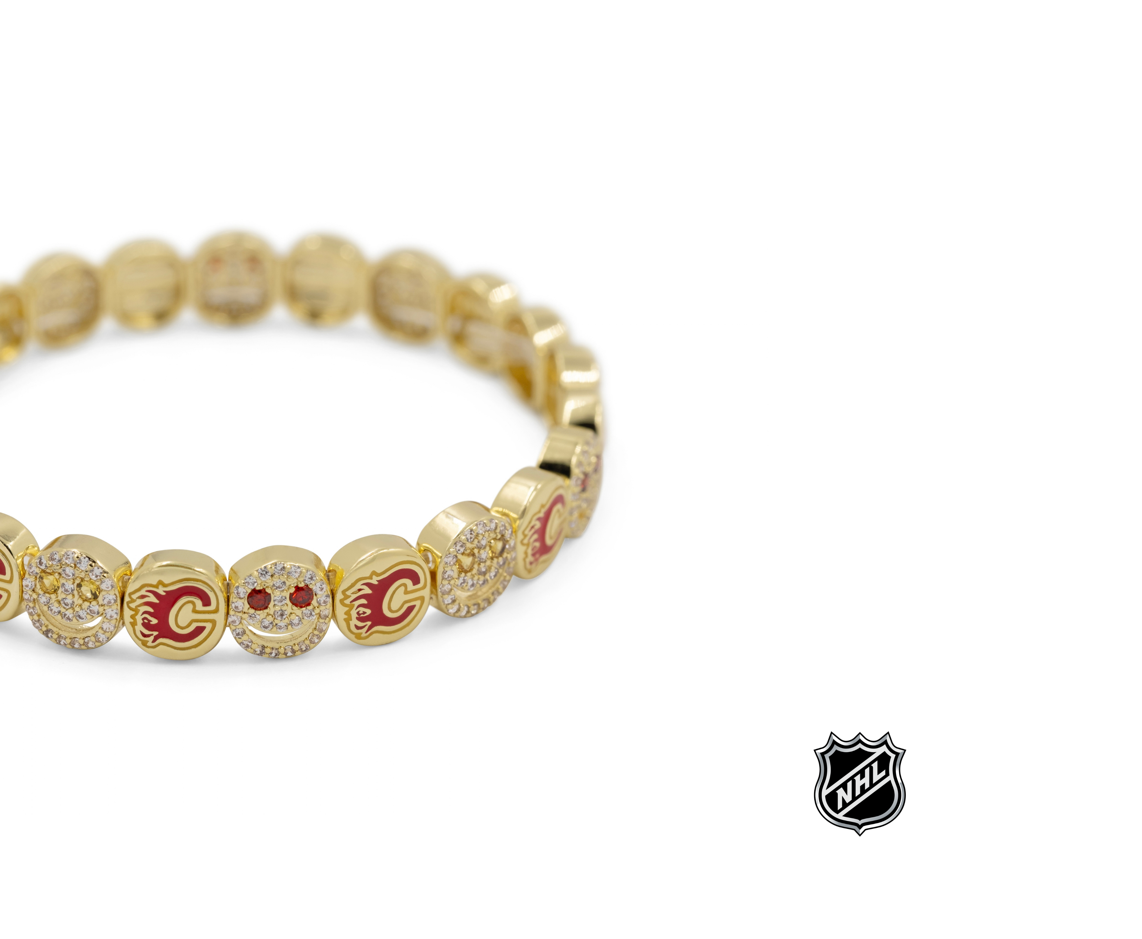 Gold-tone NHL charm bracelet with round colorful team logo charms and sparkling details