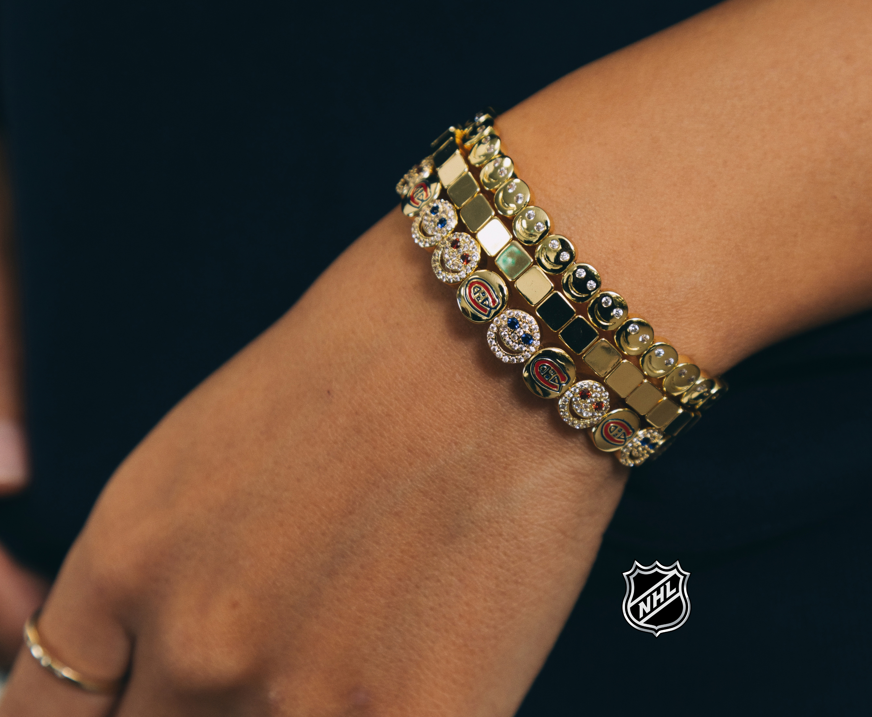 Gold NHL bracelet with linked square panels and round team logo charms