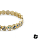 Gold-tone NHL charm bracelet with colorful team logo beads and glittering crystal accents