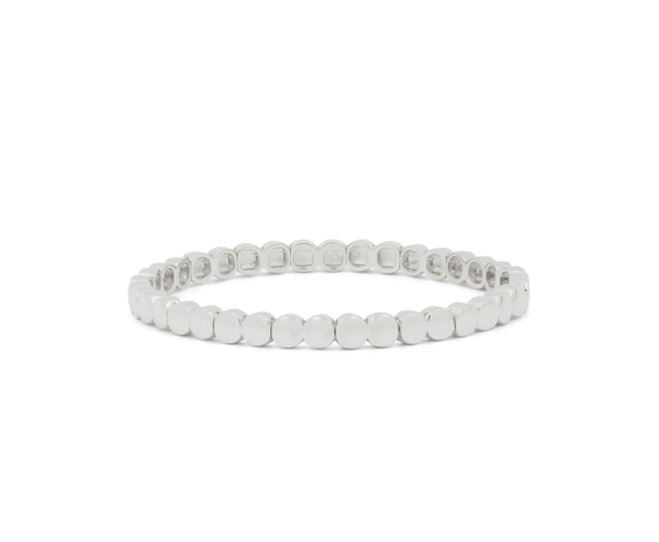 A silver tennis bracelet with round-cut stones, displayed in a circular shape against a plain white background.