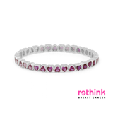 Silver heart tennis bracelet with pink heart gemstones, flex fit
