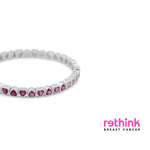 Silver heart tennis bracelet with pink heart gemstone row