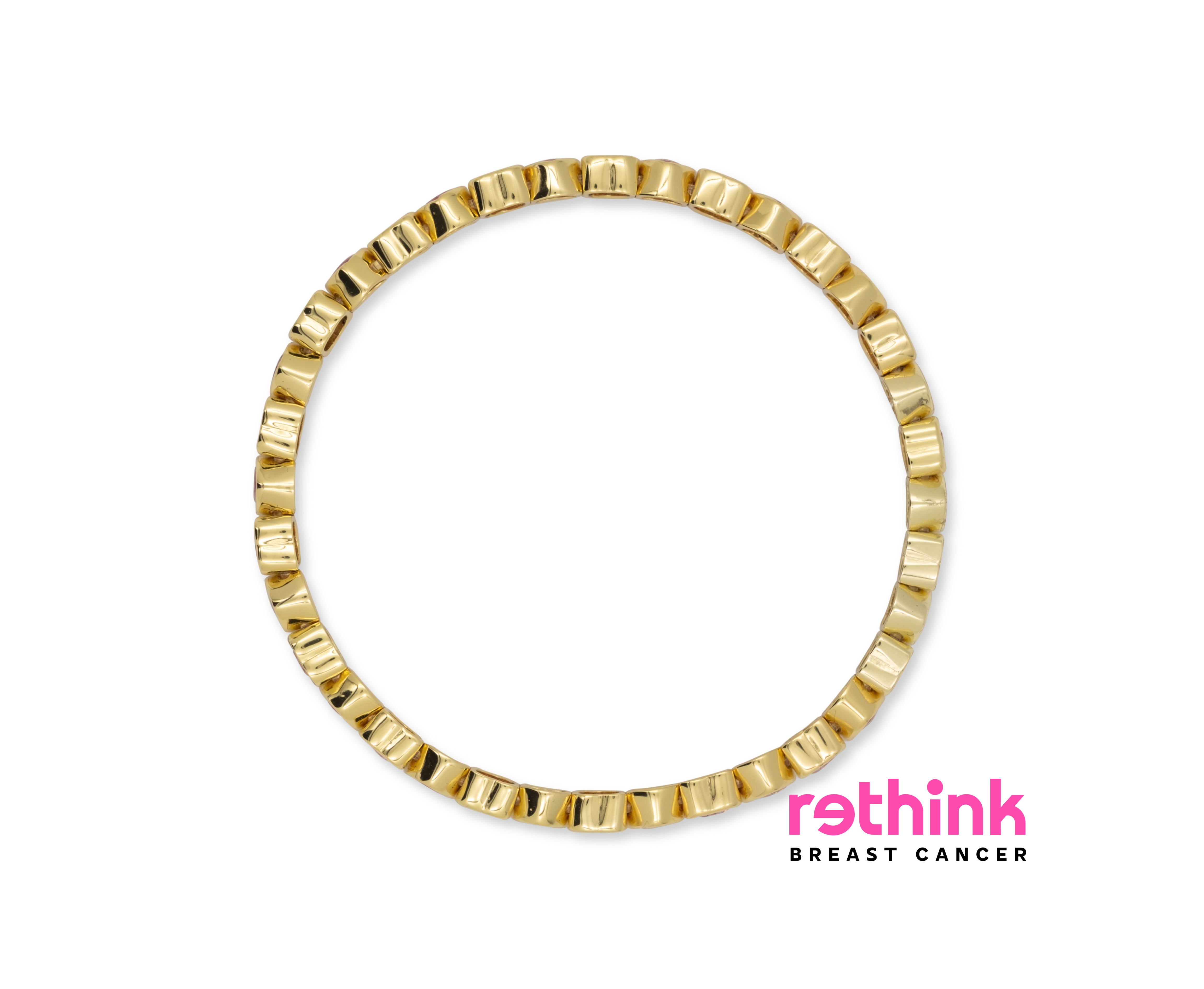 A gold-plated circular ring with a textured, segmented outer edge, shown against a plain white background.