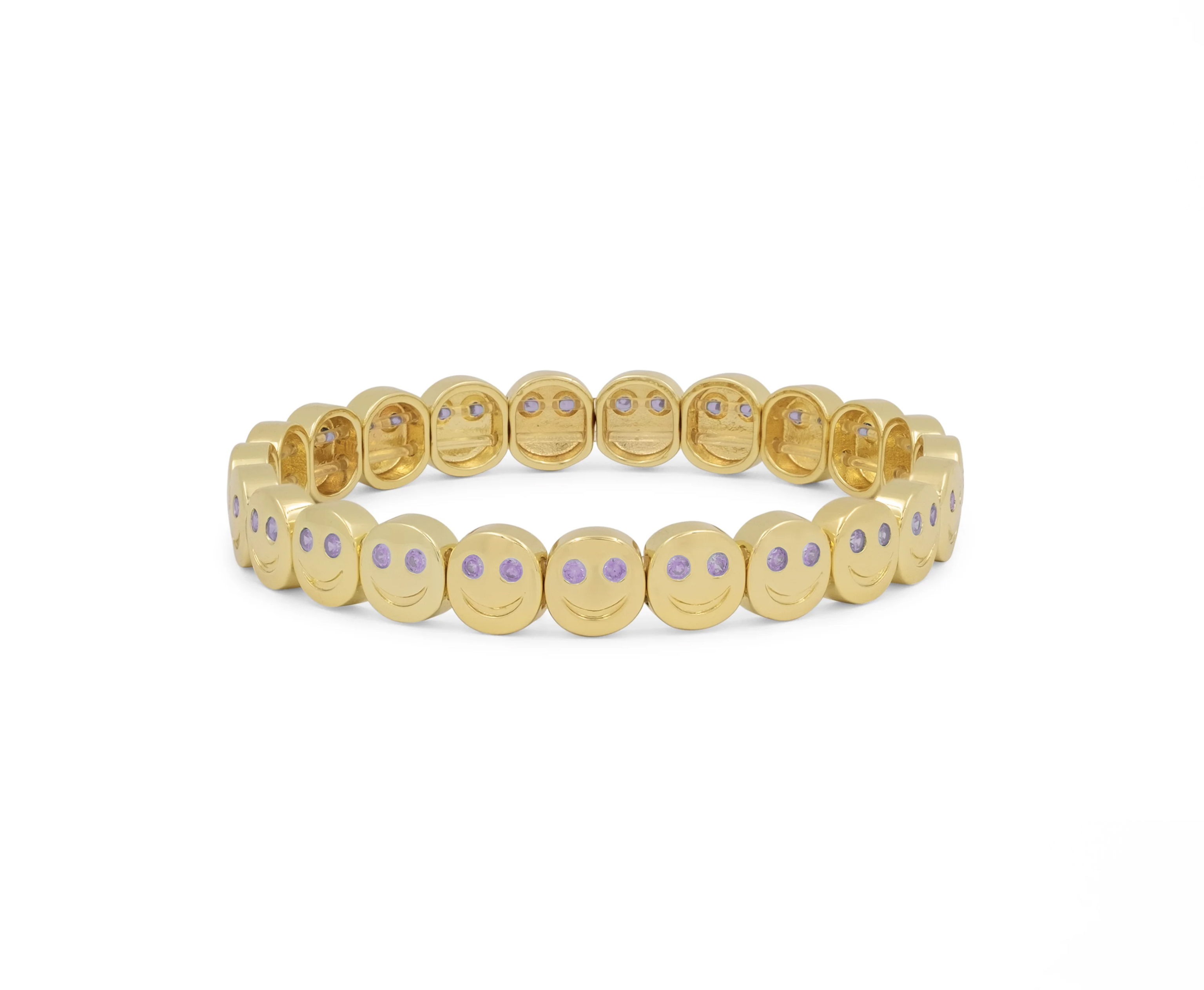 Gold bracelet with small round stones on a white background