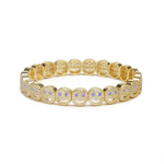 Gold bracelet with embedded stones on a white background