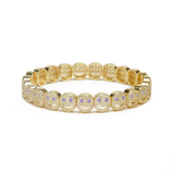 Gold bracelet with embedded stones on a white background