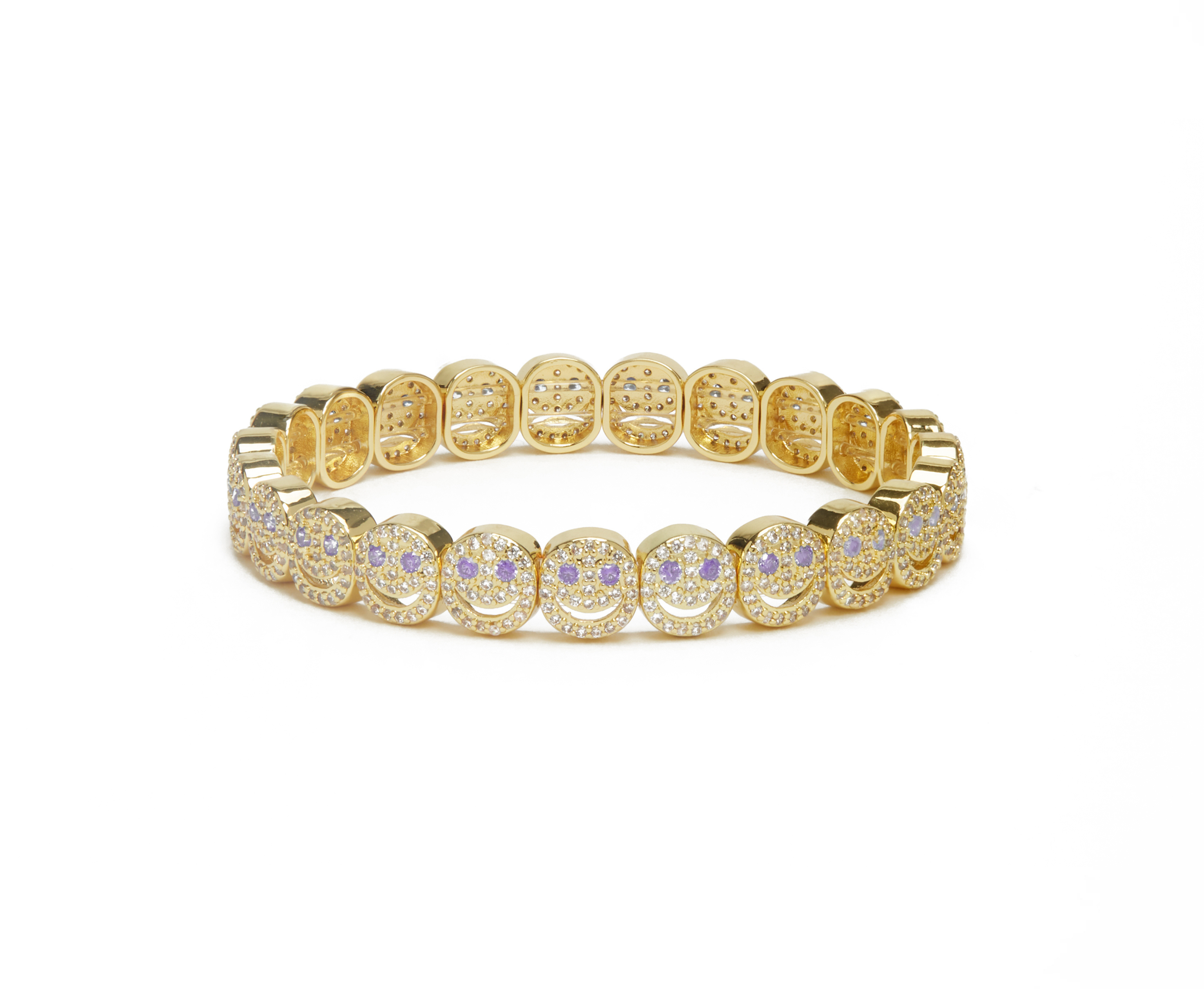 Gold bracelet with embedded stones on a white background