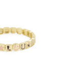 Gold bracelet for women with dallas charms on it 
