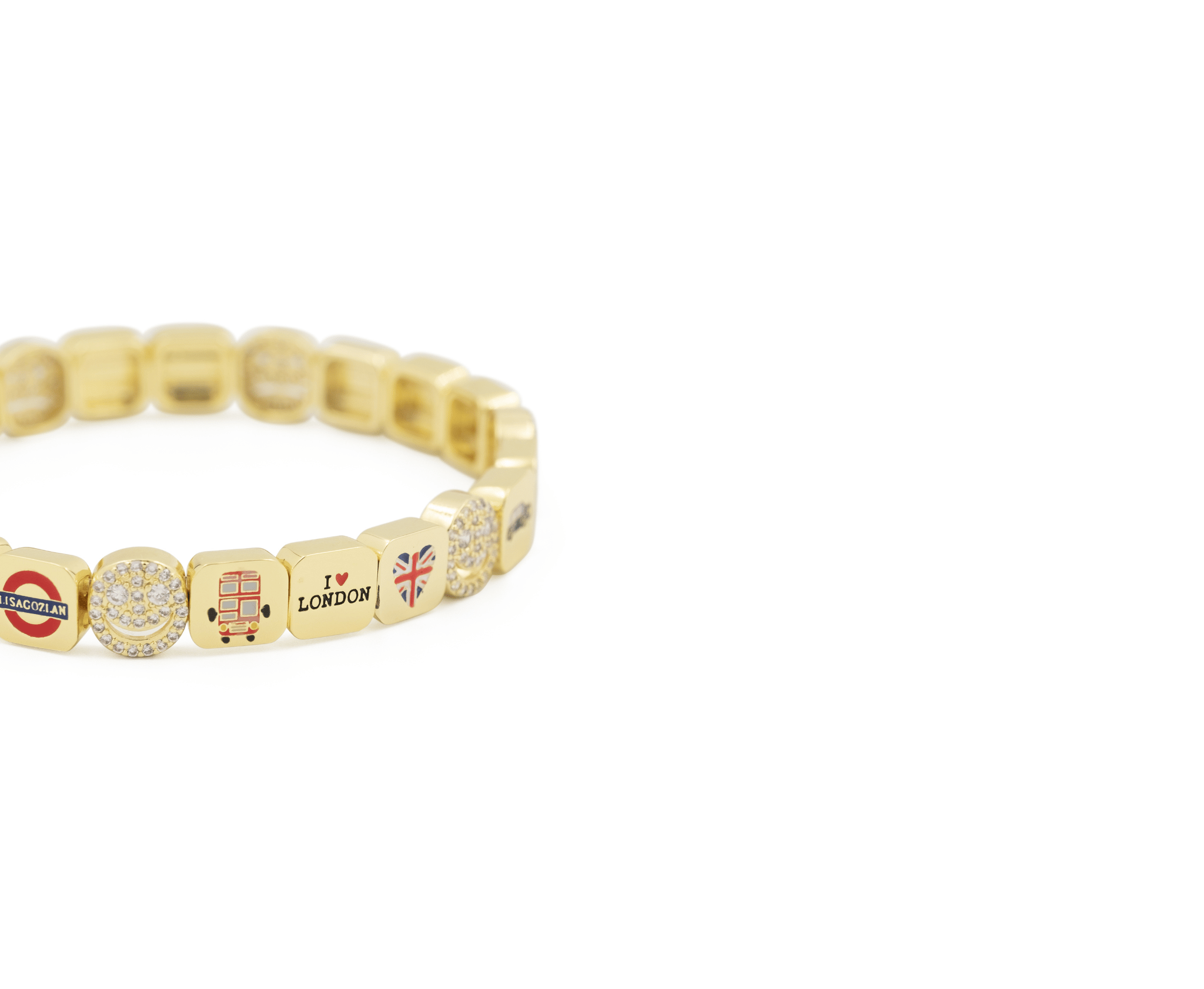 Gold beaded bracelet with various charms on a white background