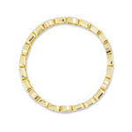 Gold ring with a textured band on a white background