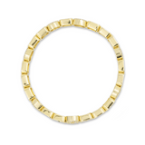 Gold ring with a textured band on a white background