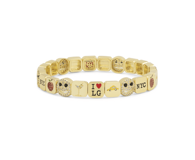 Gold bracelet with various charms on a white background