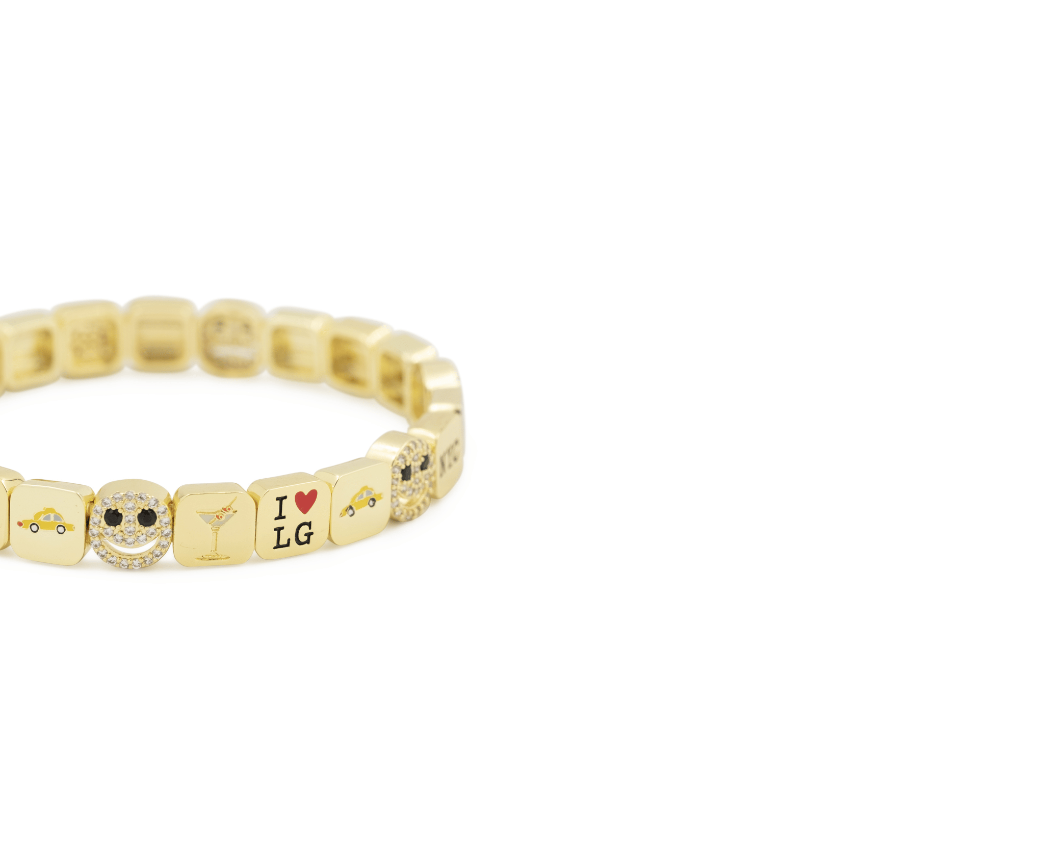 Gold bracelet with various charms on a white background