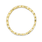 Gold ring with a unique design on a white background