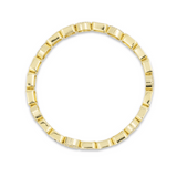 Gold ring with a unique design on a white background