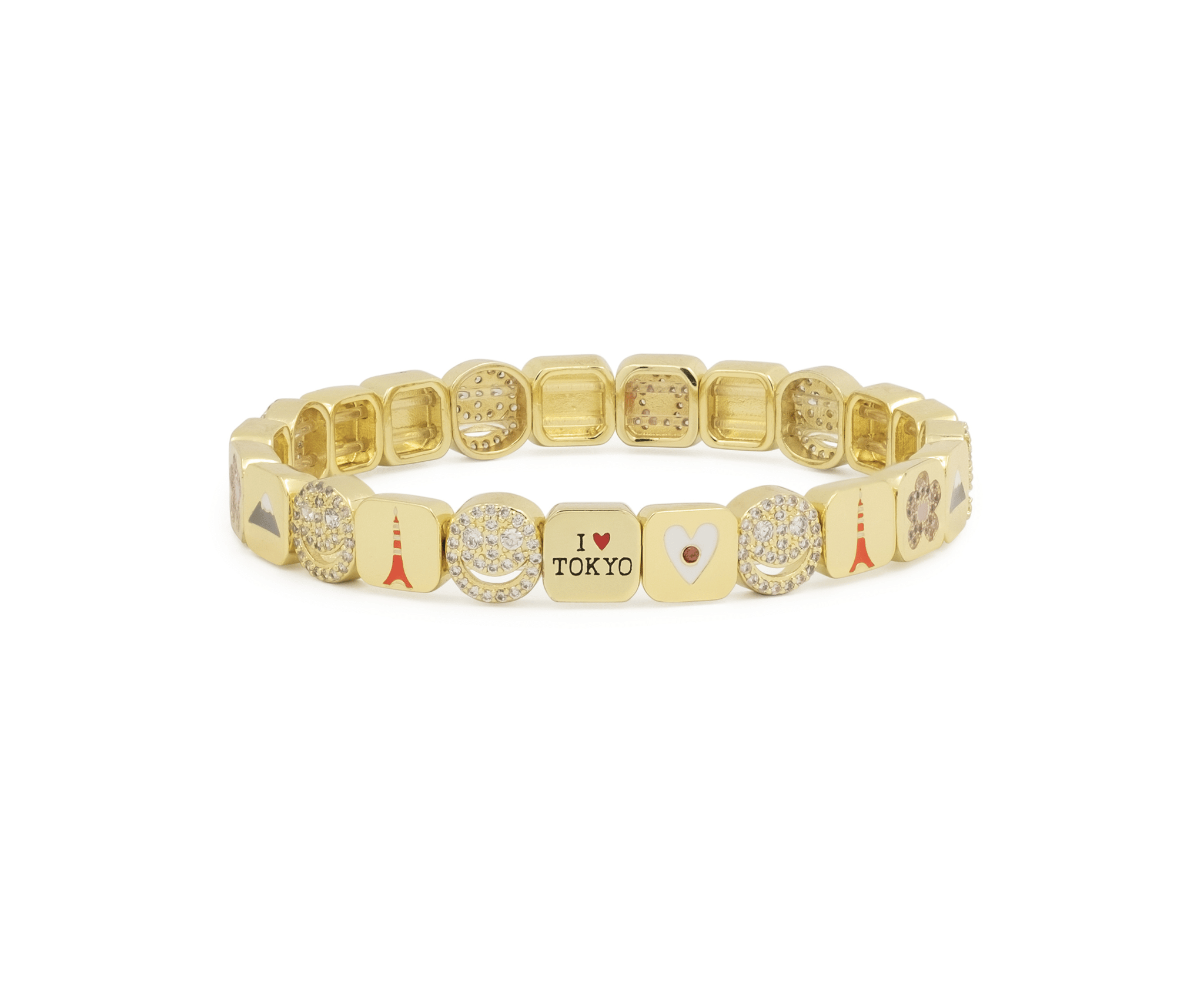 Gold bracelet with various charms on a white background