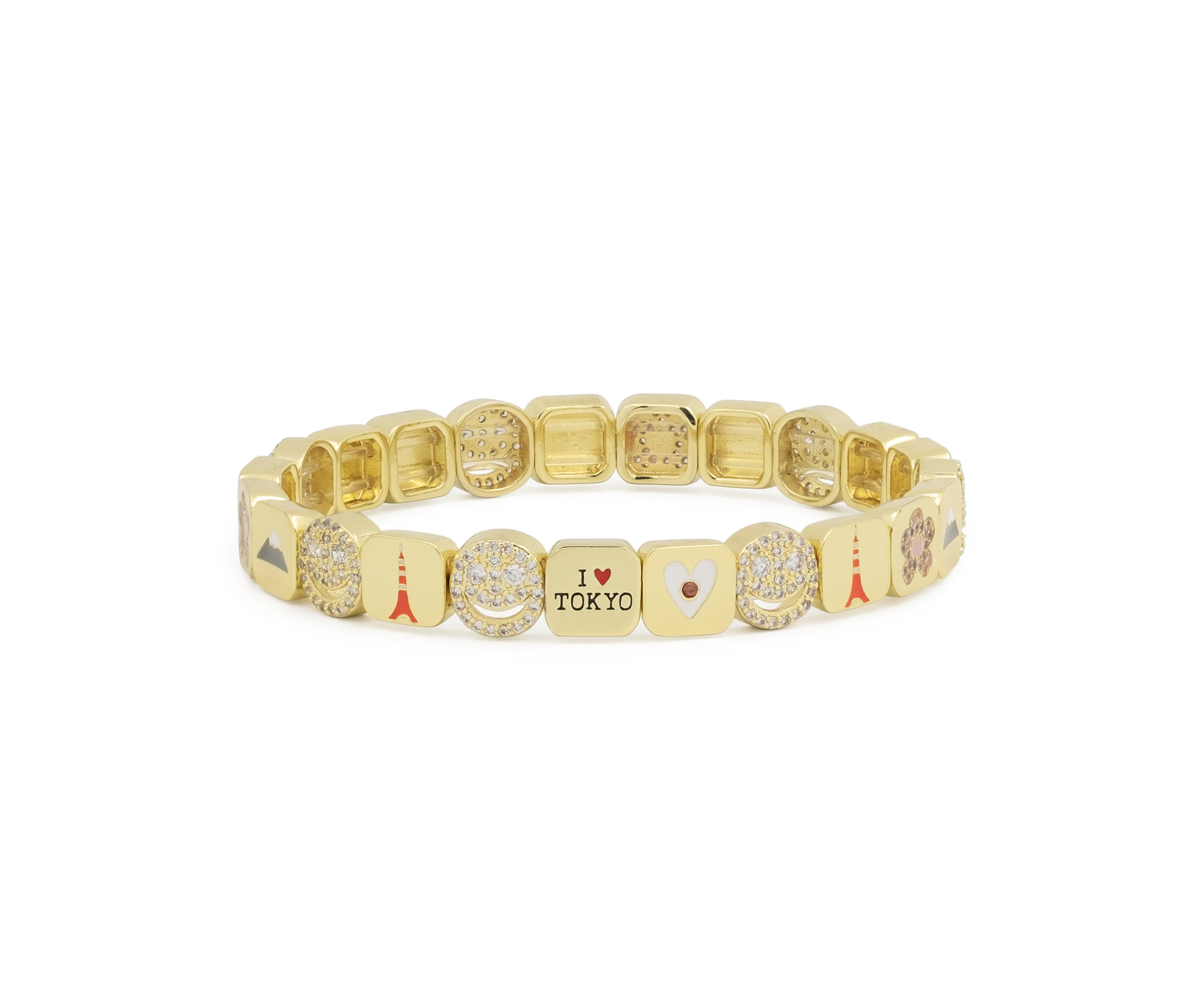 Gold bracelet with various charms on a white background