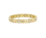 Gold bracelet with various charms on a white background