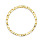 Gold ring with a beaded design on a white background