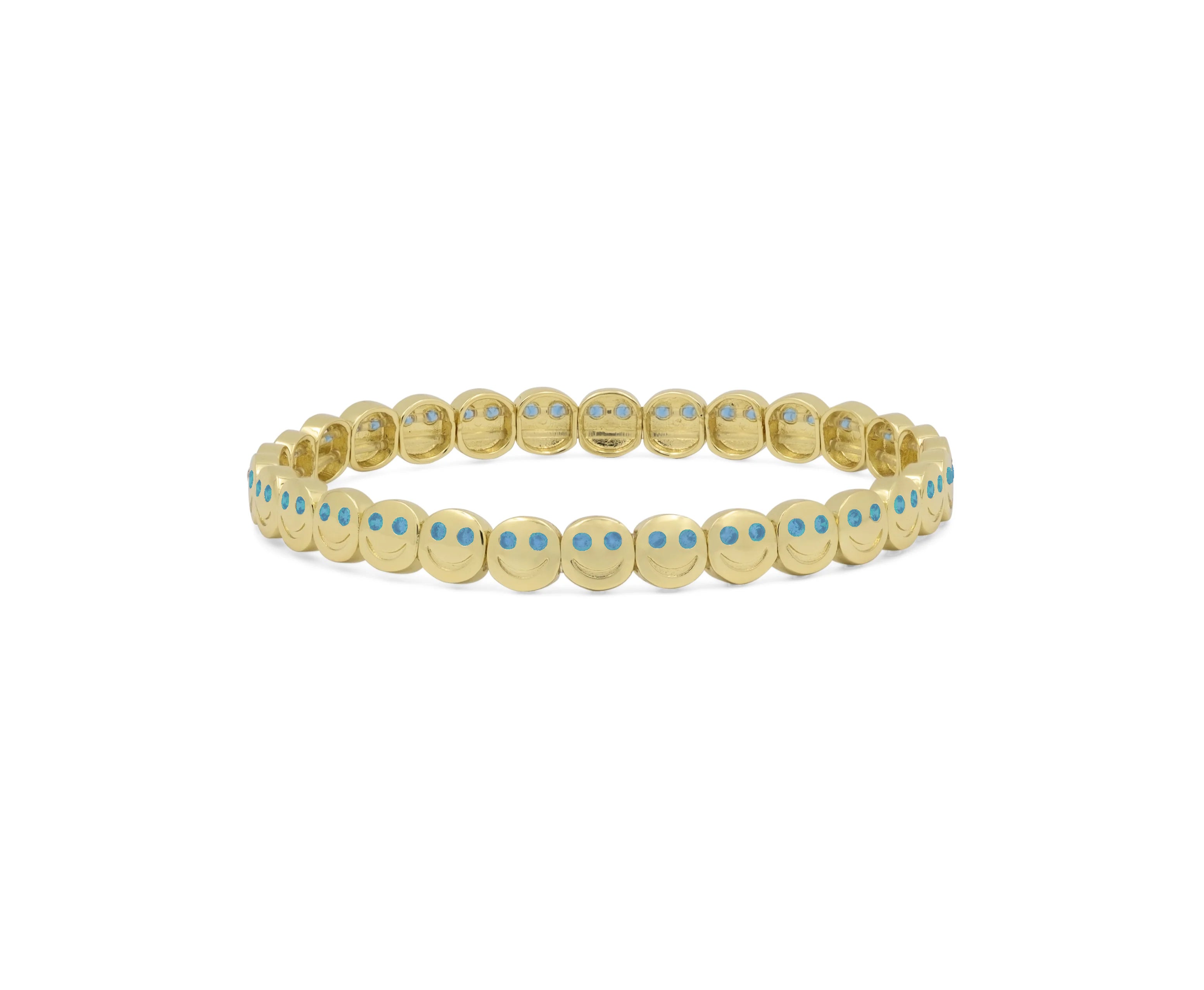 Gold bracelet with blue stones on a white background
