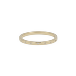 Gold ring with small diamonds on a white background