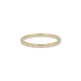 Gold ring with small diamonds on a white background