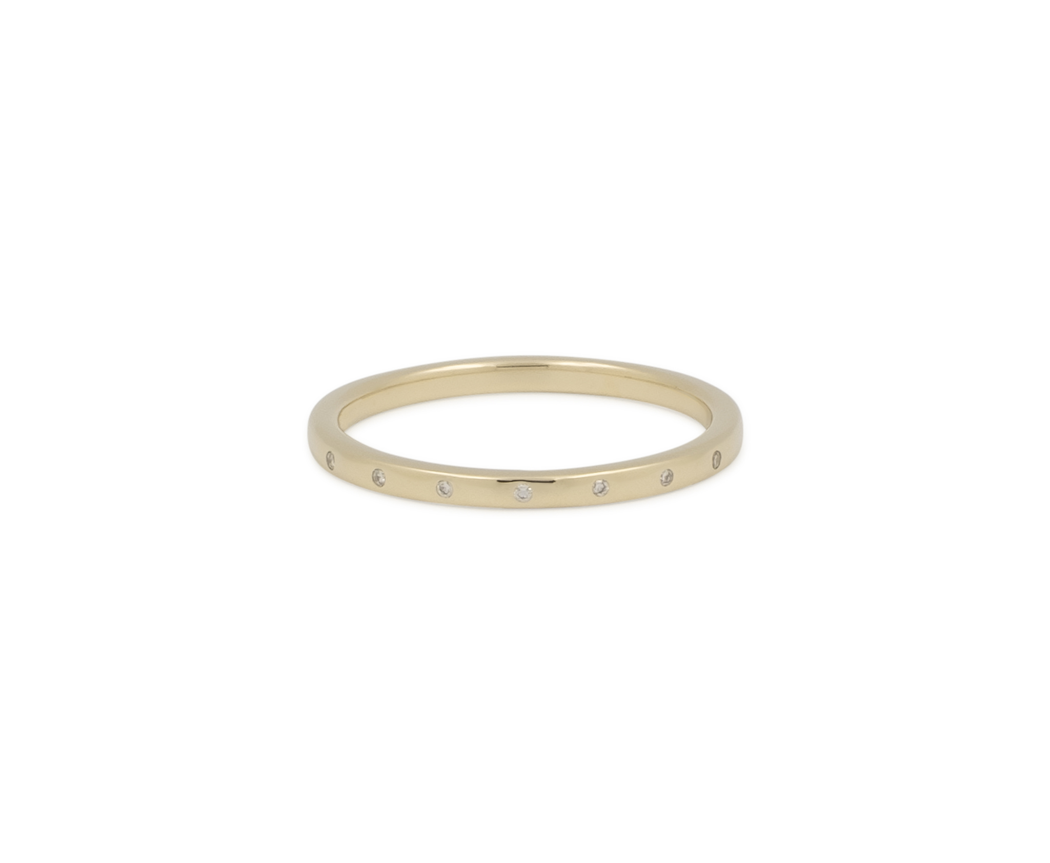 Gold ring with small diamonds on a white background