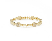Yellow gold beaded charm bracelet with round smiley face accents